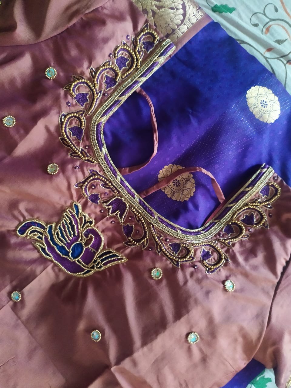 Classic pot neck maggam work blouse back with gold bead borders and stone lace
