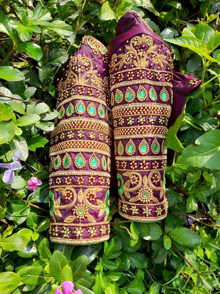Pair of purple silk bridal blouse sleeves with emerald stones and heavy aari work